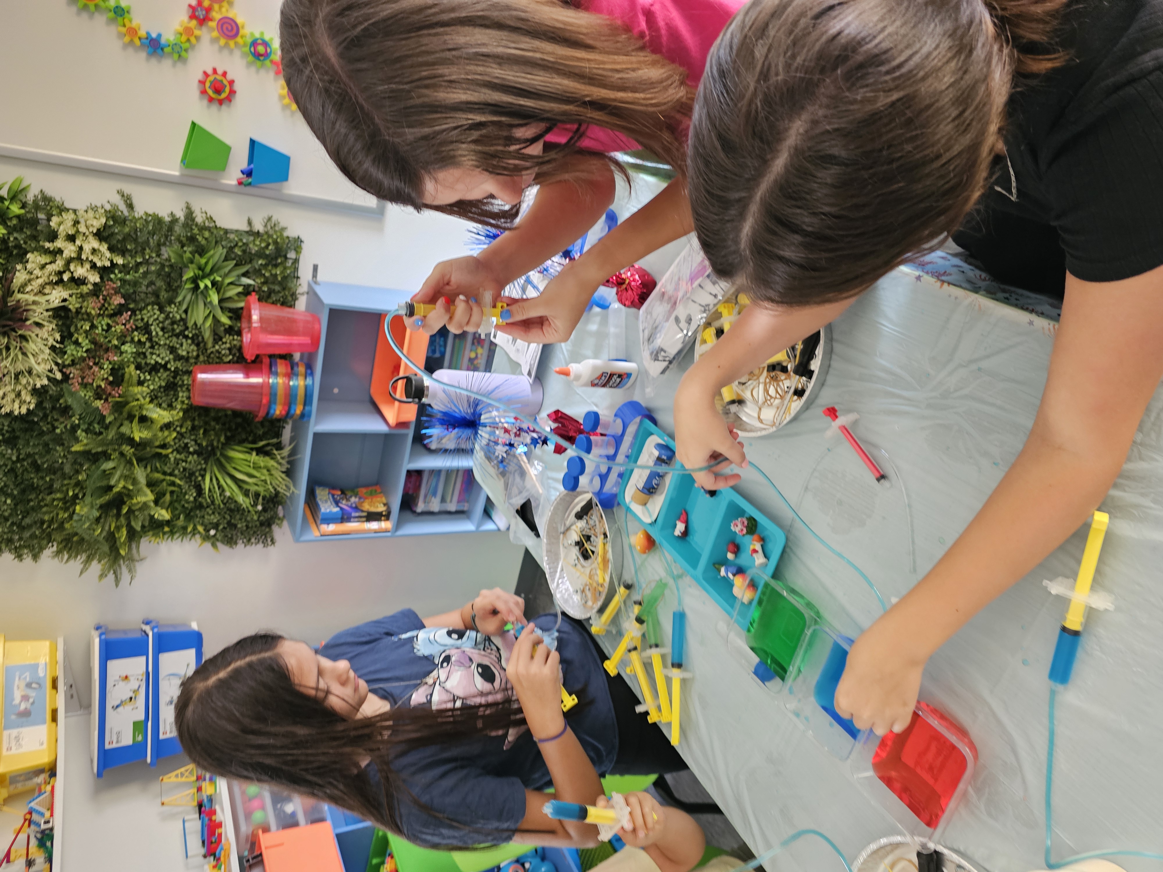 Kids and teacher at a hands-on summer activity