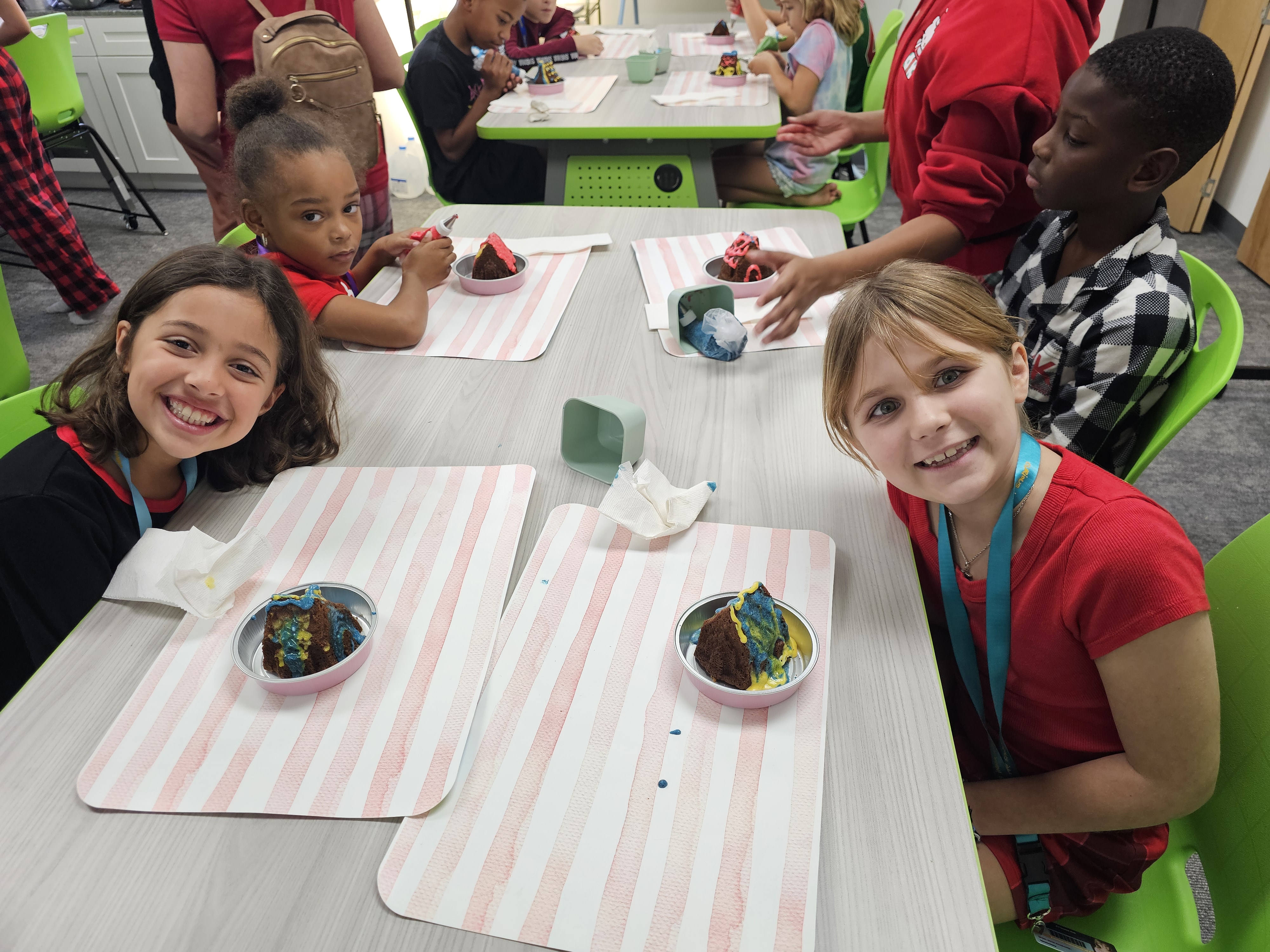 Students gathered around a table during a hands-on class